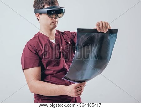 Doctor Uses Augmented Reality Goggles To Exam X-rays Film