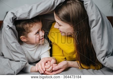 Front View Of Young Mother And Little Girl Enjoying Sweet Moments Of Parent And Kid Bonding Together