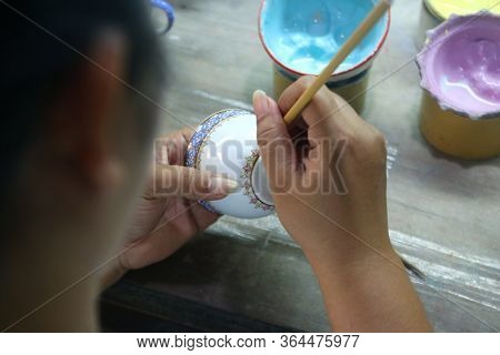 Artist Painting Benjarong Ceramic Ware