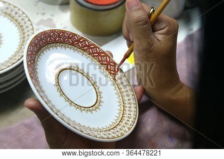 Artist Painting Benjarong Ceramic Ware
