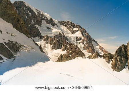 Beautiful Stone Mountain With White Snow On Ground, Natural Landscape Background