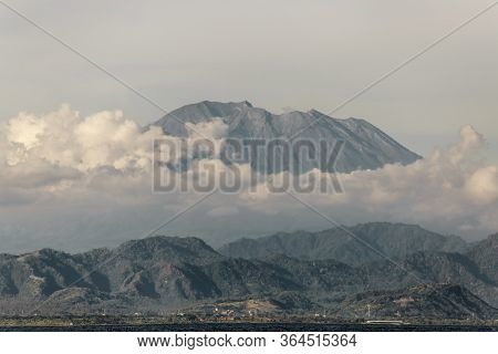 Mountains Surrounded By Clouds. Near The Sea