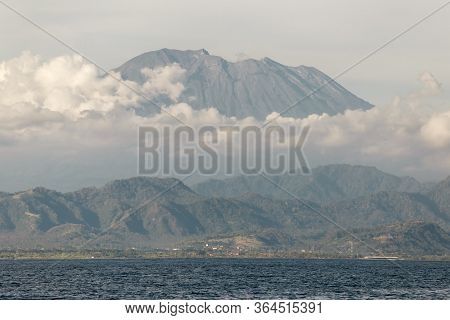 Mountains Surrounded By Clouds. Near The Sea