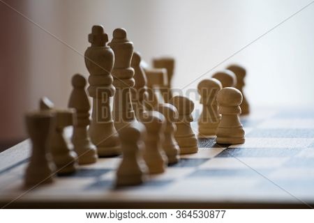 Chess Pieces On The Chess Board With Selective Focus And Crop Fragment. Business And Motivation Conc