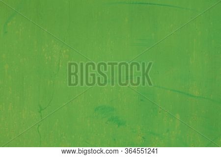 Metallic Wall Background, Texture, Colored In Green Color With Small Rusty Cracks And Paint Strokes.