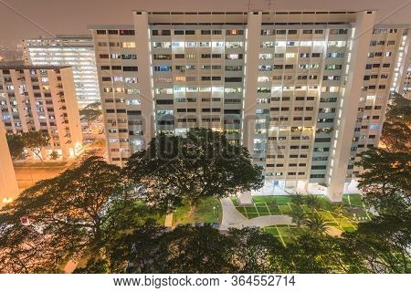 Lookup Down From Rooftop To Playground Courtyard Of A Public Housing Estate In Eunos, Singapore