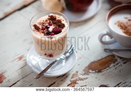 Tiramisu, Traditional Italian Dessert In Glass On A Table