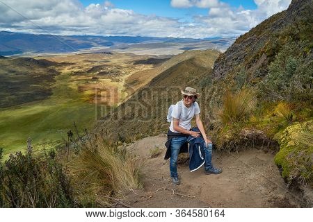 MAn hiking up Mount Ruminahui in Cotopaxi national park in th Andes, Ecuador