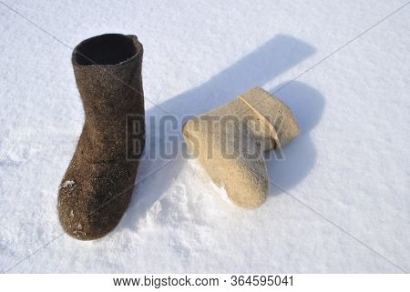 Valenoks Of Different Colors. Boots Top View. Valenok Lies In The Snow. Valenok Is Standing In The S