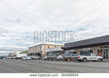 Harrismith, South Africa - March 16, 2020:  A Street Scene, With Businesses And Vehicles, In Harrism