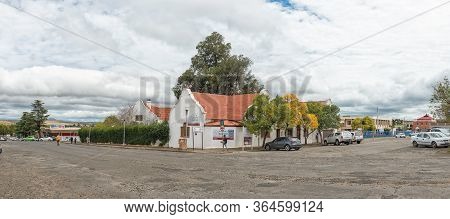 Harrismith, South Africa - March 16, 2020:  A Panoramic Street Scene, With Businesses,people And Veh