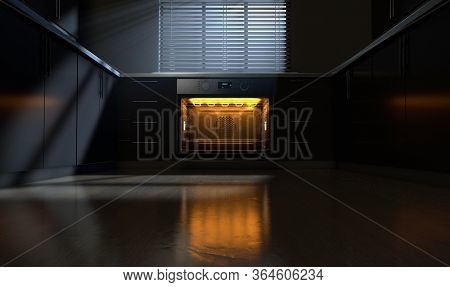 A Look Across A Clean Kitchen With Cupboards And An Open Empty Hot Oven With Moon Light Coming Throu