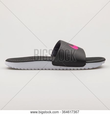 Vienna, Austria - February 19, 2018: Nike Kawa Slide Black, Pink And White Sandal On White Backgroun