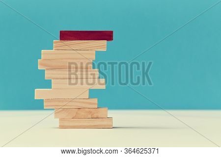 Personal Identity. Teamwork And Teambuilding. Not Like Everyone. Pile Of Wooden Planks With One Red 