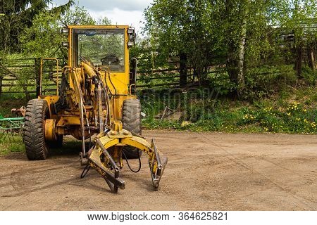 Old Digger Used To Move And Load Manure In Agriculture. Good For Background. Czech Republic