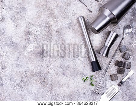 Different Bar Tools For Making Cocktail. Shaker, Jigger, Spoon, Muddler And Whiskey Stones