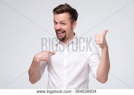 Man Shows Himself With Thumbs, Smiles Satisfied Happy, Pointing Oh His Chest Bragging.