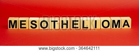 Inscription Mesothelioma On Wooden Cubes Isolated On A Red Background. Learn More About Mesothelioma