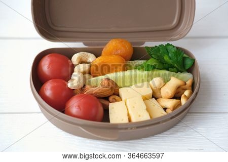 Back To School Concept. Healthy Lunch Box With Cheese, Tomatoes, Cocumber And Nuts. School Lunch For