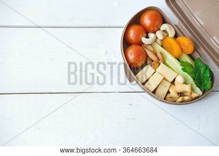 Back To School Concept. Healthy Lunch Box With Cheese, Tomatoes, Cocumber And Nuts. School Lunch For