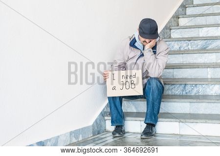 Need A Job, Asian Unemployed Adult Male With Poster. Unemployment, Loss Job From Coronavirus Crisis 