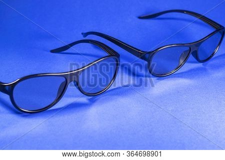 3D Glasses For Watching Movies On A Blue Background