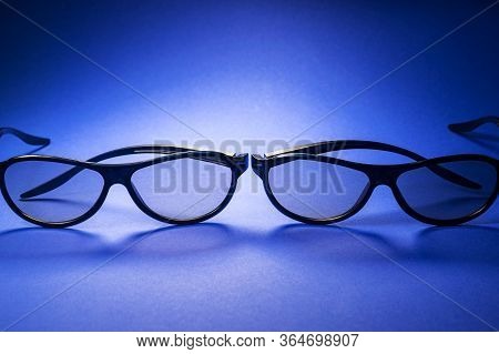 3D Glasses For Watching Movies On A Blue Background