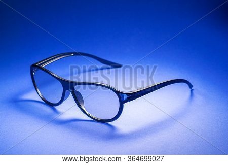 3D Glasses For Watching Movies On A Blue Background