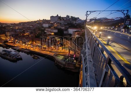 Dom Luis I Bridge an Douro riverd at dusk, Porto - Portugal.
