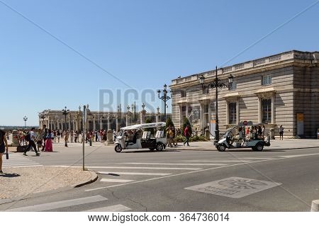 Trolleys For A Tourist Tour Parked At The Door Of The Palacio De Oriente In Madrid De Los Austrias. 