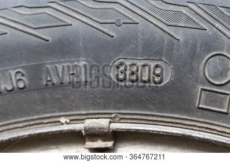 Stamping On A Tire Where Date And Year Of Issue Are Indicated. Close-up. Old Wheel, Replacement Requ