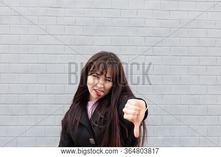 The Woman Shows Hand Sign That Everything Is Bad