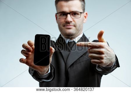 Portrait Of A Man Pointing At Smartphone