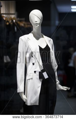 Female Mannequin In A Shop Window.woman Mannequin In Business Clothes.