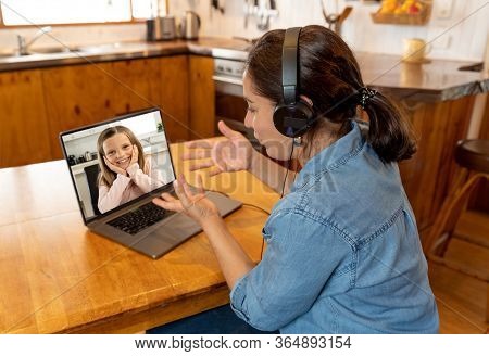 Covid-19 Online Education. Primary Teacher And Pupil Interacting In Live Video Lesson. Woman Tutor W