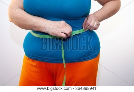 Measure The Waist With A Centimeter Tape. Big Size. The Problem Of Excess Weight. Full Belly And Fol