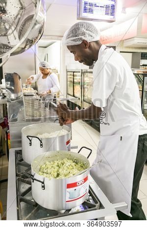 African Male Chef Staff Working In The Kitchen Of Butchery And Deli Section At Local Pick N Pay Groc