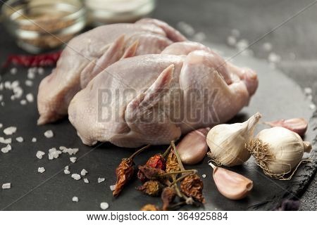 Raw Quail Meat On Kitchen, Cooking Gourmet Bird. Healthy Diet Recipe.