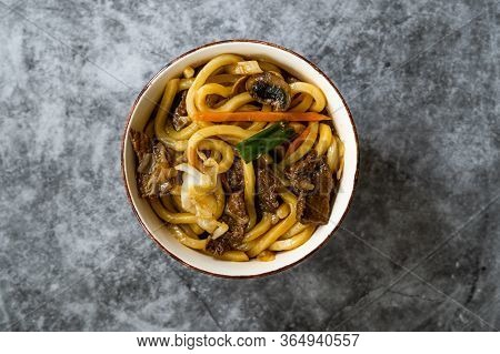 Asian Style Japanese Udon Noodle Soup With Beef, Mushroom And Vegetables.