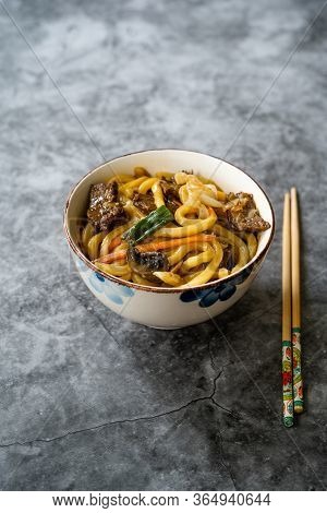Asian Style Japanese Udon Noodle Soup With Beef, Mushroom And Vegetables.