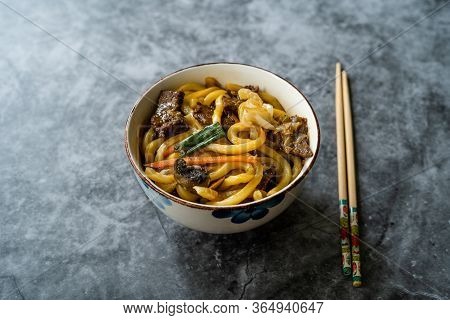 Asian Style Japanese Udon Noodle Soup With Beef, Mushroom And Vegetables.