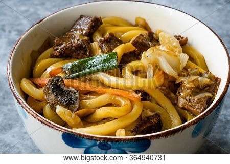 Asian Style Japanese Udon Noodle Soup With Beef, Mushroom And Vegetables. Close Up Macro View. Tradi