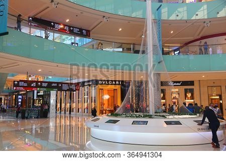 Dubai, Uae - November 22, 2017: Shoppers Visit Dubai Mall. It Is The Largest Mall In The World By To
