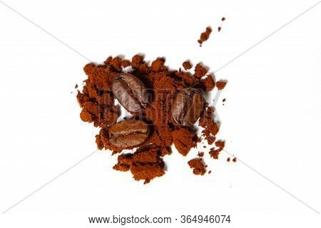 Ground Coffee And Roasted Beans On A White Background, Isolated. Chocolate Color Of Robusta Coffee.