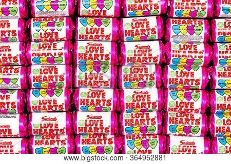 Southampton, UK - 3rd May 2020:  background of Swizzels Love Hearts. This popular childhood fizzy sweet is a hard candies embossed with love messages and has been in production for nearly 70 years