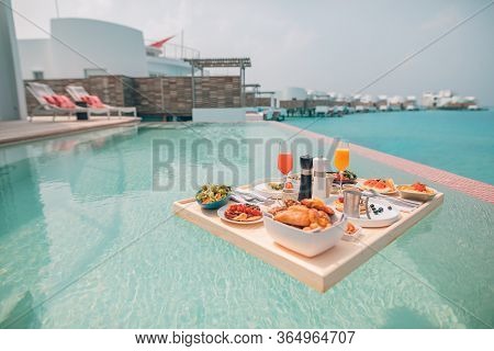 Breakfast In Swimming Pool, Floating Breakfast In Luxurious Tropical Resort. Table Relaxing On Calm 