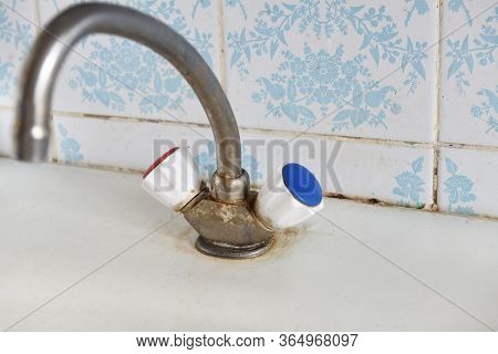 Old, Rusty Kitchen Mixer Mounted On An Enameled Sink