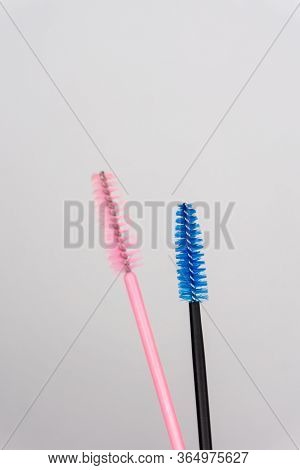 Two Colour Eyelash Brush On White Background. Blue, Black And Soft Pink Yelash Brush For Girl Master