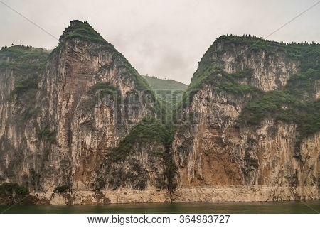 Baidicheng, China - May 7, 2010: Qutang Gorge On Yangtze River. 2 Straigth Down Brown Cliffs With So