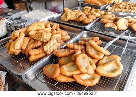 Various Types Of Fried Bread Sticks Or You Tiao At Hawker Stall